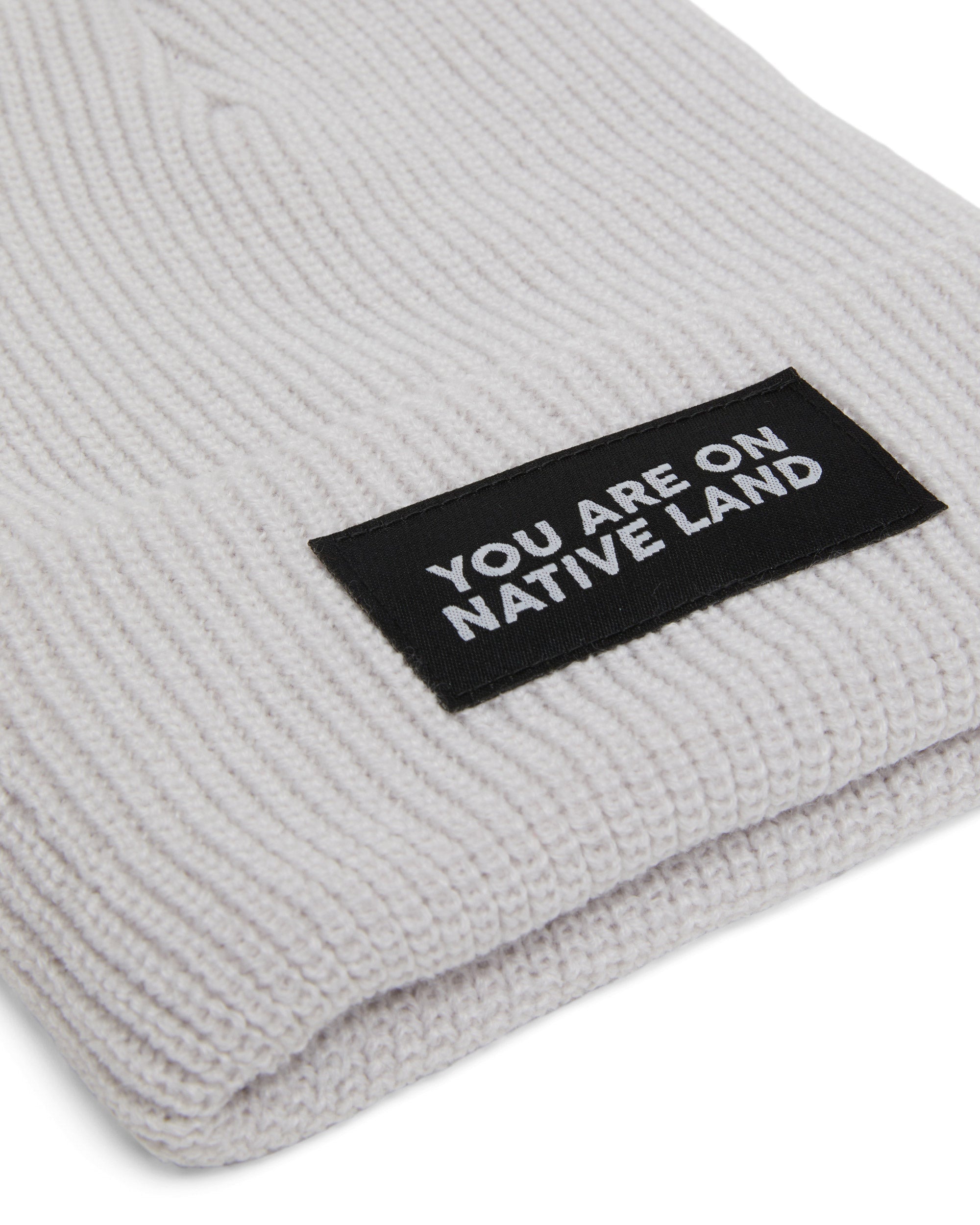 'YOU ARE ON NATIVE LAND' RIBBED BEANIE